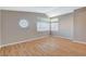 Bedroom featuring wood floors, lots of windows, and natural light at 1800 Summit Pointe Dr, Las Vegas, NV 89117