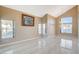 Spacious living room with large windows and lots of natural light in a neutrally painted space at 1800 Summit Pointe Dr, Las Vegas, NV 89117