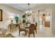 Charming dining area with a decorative chandelier and views of the kitchen at 1811 Tiger Creek Ave, Henderson, NV 89012