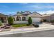 Charming single-story home with manicured lawn, neutral paint, and two car garage at 1811 Tiger Creek Ave, Henderson, NV 89012