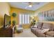 Comfortable living room with an oversized sofa, decorative lamps, and plantation shutters at 1811 Tiger Creek Ave, Henderson, NV 89012