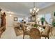 Well-lit living area with views of the dining space, tile floors, and neutral paint at 1811 Tiger Creek Ave, Henderson, NV 89012