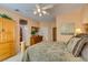 Angled view of the main bedroom with doorway to ensuite bathroom and view of the walk-in closet at 1811 Tiger Creek Ave, Henderson, NV 89012