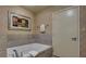 Spacious bathroom with tiled walls and floors, and a large bathtub at 211 E Flamingo Rd # 1707, Las Vegas, NV 89169