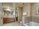 Bathroom featuring a large soaking tub, separate shower, and tiled floors at 211 E Flamingo Rd # 1707, Las Vegas, NV 89169