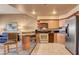 Bright kitchen with stainless steel appliances and attached eating area and view into living room at 211 E Flamingo Rd # 1707, Las Vegas, NV 89169