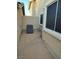 Small backyard showcasing an air conditioning unit against the building, offering a practical outdoor area at 2223 Rugged Mesa Dr, Laughlin, NV 89029