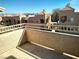 View from the balcony overlooking buildings with tile roofs and mountain range in distance at 2223 Rugged Mesa Dr, Laughlin, NV 89029