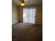 A carpeted bedroom bathed in sunlight coming from the window at 2223 Rugged Mesa Dr, Laughlin, NV 89029