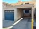 Carport and Garage featuring a blue door, and the home's address 2223, offering convenient parking at 2223 Rugged Mesa Dr, Laughlin, NV 89029