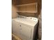 Bright laundry area equipped with a washer, dryer, and convenient shelving at 2223 Rugged Mesa Dr, Laughlin, NV 89029