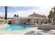 Community pool and pool house with lounge chairs and an outdoor seating area at 2223 Rugged Mesa Dr, Laughlin, NV 89029