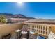 A cozy outdoor balcony features a wrought-iron railing and cushioned patio furniture at 225 Priority Point St, Henderson, NV 89012