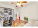 Bedroom featuring a large built-in closet, wood floors, and ceiling fan at 225 Priority Point St, Henderson, NV 89012