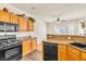 Kitchen with stainless steel appliances, granite countertops, and bright lighting at 225 Priority Point St, Henderson, NV 89012