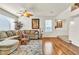 Cozy living room with hardwood floors, ceiling fan, and bright natural light at 225 Priority Point St, Henderson, NV 89012