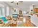 Bright living room with hardwood floors and a cozy fireplace at 225 Priority Point St, Henderson, NV 89012