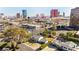 Excellent aerial view of home near the city featuring mature landscaping and surrounding buildings at 2301 W El Camino Ave, Las Vegas, NV 89102