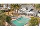 This is an aerial view of the backyard, which includes a pool, pergola, and lush trees at 2301 W El Camino Ave, Las Vegas, NV 89102