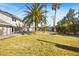 Expansive lawn and patio enhance this backyard oasis, complete with mature palm trees at 2301 W El Camino Ave, Las Vegas, NV 89102