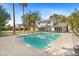 Inviting backyard with a sparkling pool, lush landscaping, and ample space for outdoor relaxation and entertainment at 2301 W El Camino Ave, Las Vegas, NV 89102