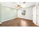 A bright bedroom features wood-look floors and a sun-filled window at 2301 W El Camino Ave, Las Vegas, NV 89102