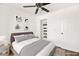 Staged bedroom featuring a comfortable bed, modern art and a custom closet at 2301 W El Camino Ave, Las Vegas, NV 89102