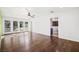 Bright living room featuring hardwood floors and French doors leading to the backyard at 2301 W El Camino Ave, Las Vegas, NV 89102