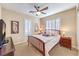 Bedroom featuring a queen bed, ceiling fan, and plantation shutters at 2375 Malaga Peak St, Las Vegas, NV 89135