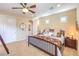 Bedroom featuring a queen bed, ceiling fan, and ensuite bathroom at 2375 Malaga Peak St, Las Vegas, NV 89135