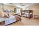 Cozy bedroom featuring a bunk bed, queen bed, and neutral decor at 2375 Malaga Peak St, Las Vegas, NV 89135