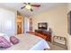 Comfortable bedroom featuring a queen bed, ceiling fan, and ensuite bathroom at 2375 Malaga Peak St, Las Vegas, NV 89135