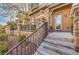 Close-up of the home's entrance with stone accents, updated lighting, and manicured landscaping at 2375 Malaga Peak St, Las Vegas, NV 89135