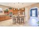 Bright and airy kitchen with stainless steel appliances, granite countertops, and a breakfast bar at 2375 Malaga Peak St, Las Vegas, NV 89135