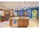 Well-appointed kitchen island overlooks the living area and has pendant lighting at 2375 Malaga Peak St, Las Vegas, NV 89135