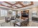 Comfortable living room with coffered ceilings, stylish furniture, and abundant natural light at 2375 Malaga Peak St, Las Vegas, NV 89135