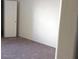 An empty bedroom includes carpet, closet door, and bright, clean, white walls at 2725 S Nellis Blvd # 1158, Las Vegas, NV 89121