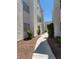 Exterior shot of a condo with a sidewalk, well-maintained plants, and stairs to the second level at 2725 S Nellis Blvd # 1158, Las Vegas, NV 89121