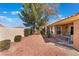 Cozy backyard area with desert landscaping and a small patio set, perfect for outdoor relaxation at 2735 Faiss Dr, Las Vegas, NV 89134