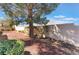 Backyard with desert landscaping, a privacy wall, and views of the mountains at 2735 Faiss Dr, Las Vegas, NV 89134