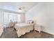 Bedroom with bay window, neutral carpet, and a ceiling fan at 2735 Faiss Dr, Las Vegas, NV 89134