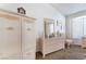 Bedroom with white wicker furniture, neutral carpet, and bright lighting at 2735 Faiss Dr, Las Vegas, NV 89134