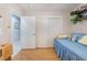 Bedroom featuring a closet with sliding doors and a comfortable blue daybed at 2735 Faiss Dr, Las Vegas, NV 89134