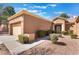 Charming single-story home featuring desert landscaping, a two-car garage, and a welcoming front entrance at 2735 Faiss Dr, Las Vegas, NV 89134