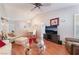 Spacious living room with hardwood floors adjacent to the dining area, creating an open concept at 2735 Faiss Dr, Las Vegas, NV 89134