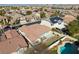 Aerial view of a backyard featuring a sparkling swimming pool in a tranquil neighborhood at 283 Parisian Springs Ct, Las Vegas, NV 89148