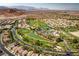 Panoramic aerial shot showcasing the community's lush golf course and attractive landscaping at 283 Parisian Springs Ct, Las Vegas, NV 89148