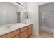 Bathroom featuring double sinks and a shower at 283 Parisian Springs Ct, Las Vegas, NV 89148