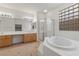 Bathroom featuring double sinks, a shower, and a tub at 283 Parisian Springs Ct, Las Vegas, NV 89148