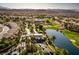 Beautiful Primary-planned community featuring lush landscaping, golf course, and lake at 283 Parisian Springs Ct, Las Vegas, NV 89148